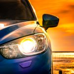 blue-compact-suv-car-with-sport-modern-design-parked-concrete-road_33867-60